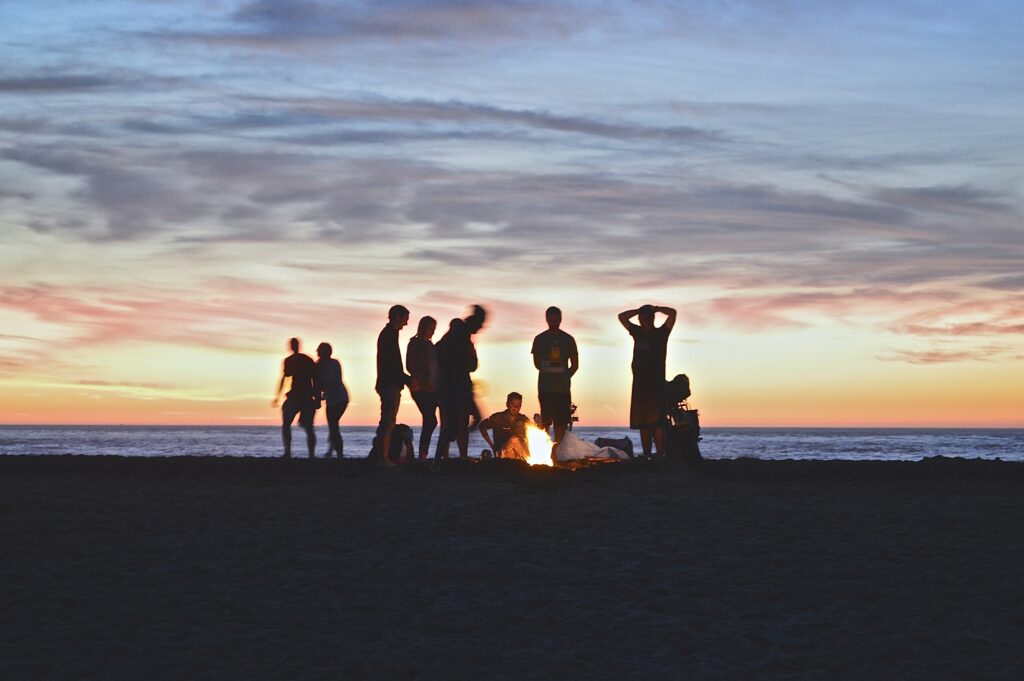 group of students at the beach at night